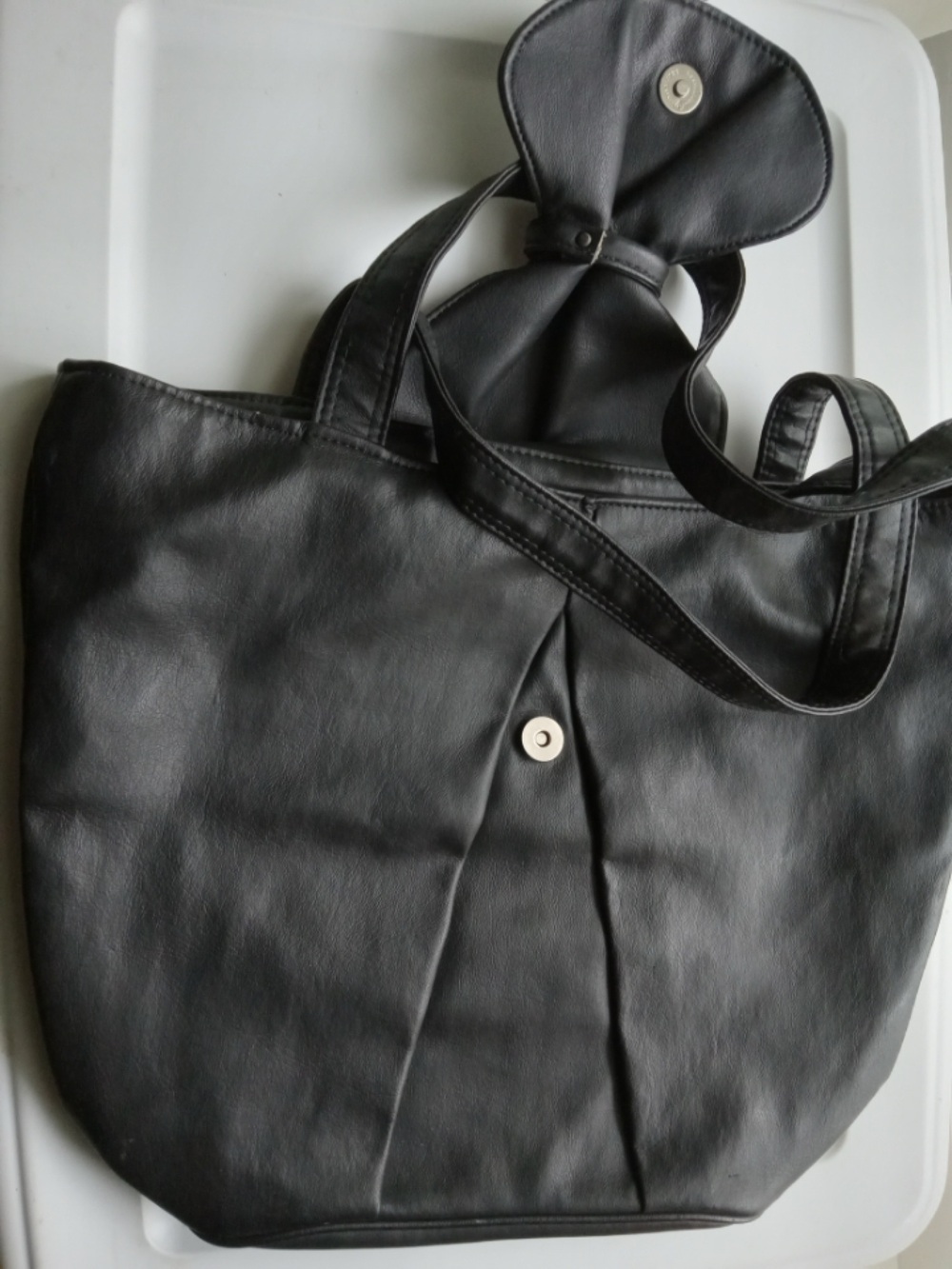 Leather tote with bow tie snap